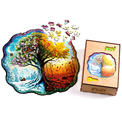 Conjunto do quebra-cabeça Puzi Quatro Estações do Ano parcialmente montado ao lado de sua embalagem premium de madeira